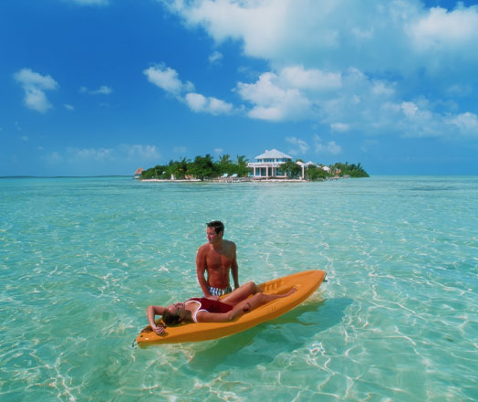 Happy couple enjoying the paradise at Cayo Espanto Belize 